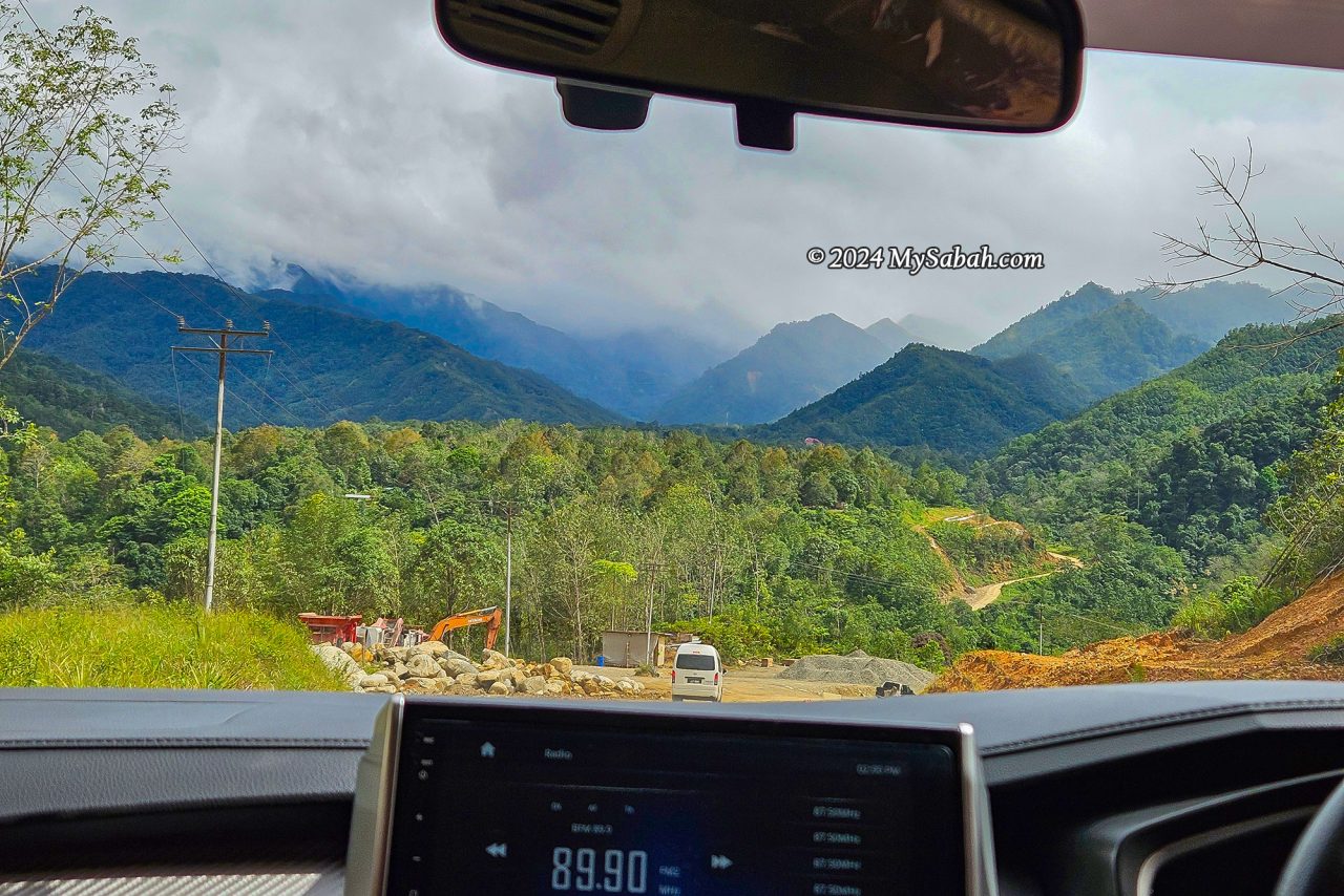 Beautiful mountain range view from the car on the way to Sayap Substation